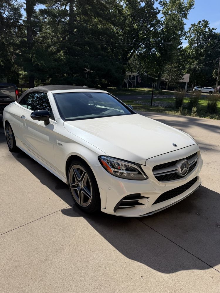 White Mercedes convertible after a full detail